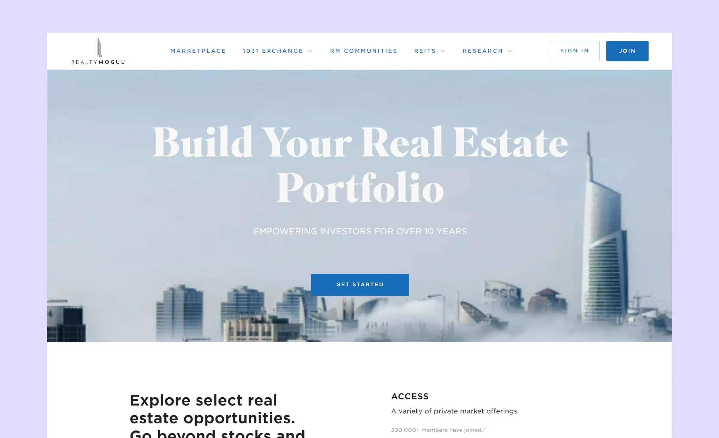 RealtyMogul’s real estate website design features a header with an image of skyscrapers in the background, a slogan that reads "Build Your Real Estate Portfolio," and a "Get Started" button.