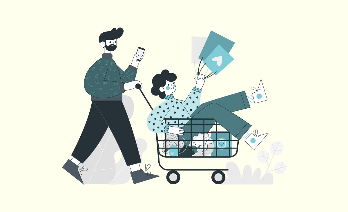The article cover illustrates its title "How to build a custom e-commerce website." The image shows a couple: a man pushing a woman in a cart. The man is holding a phone, and the woman is holding shopping bags. In the cart where the woman is riding, there are also groceries: a bag of potatoes, an eggplant, an apple, some cauliflower, and cat food.