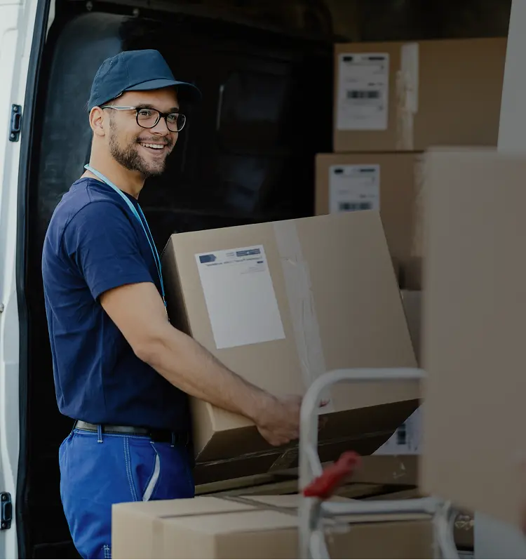 Courier loading parcels into a Drivery delivery van.
