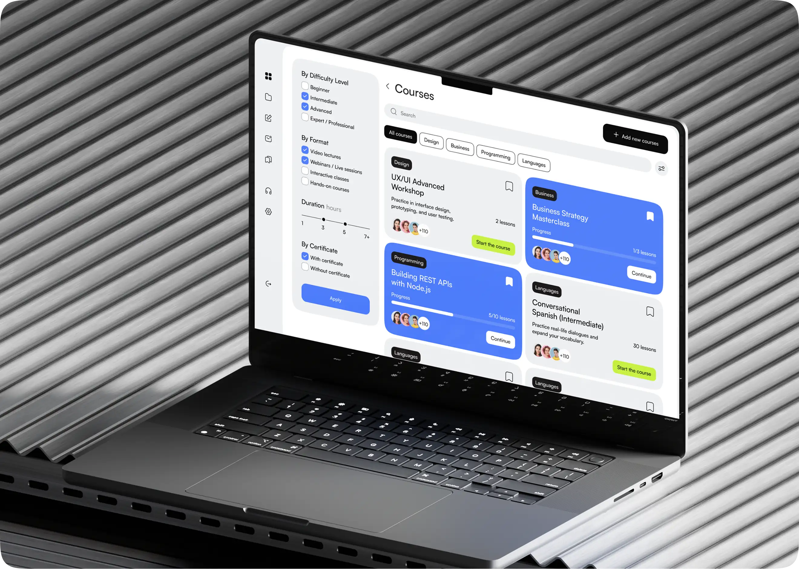 Laptop showing the learning platform interface on a dark background.