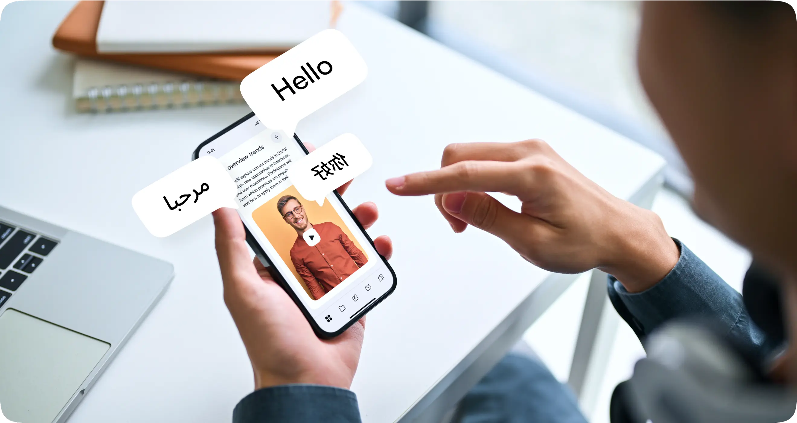 Hand holding a phone showing a lesson with instant translation into multiple languages.