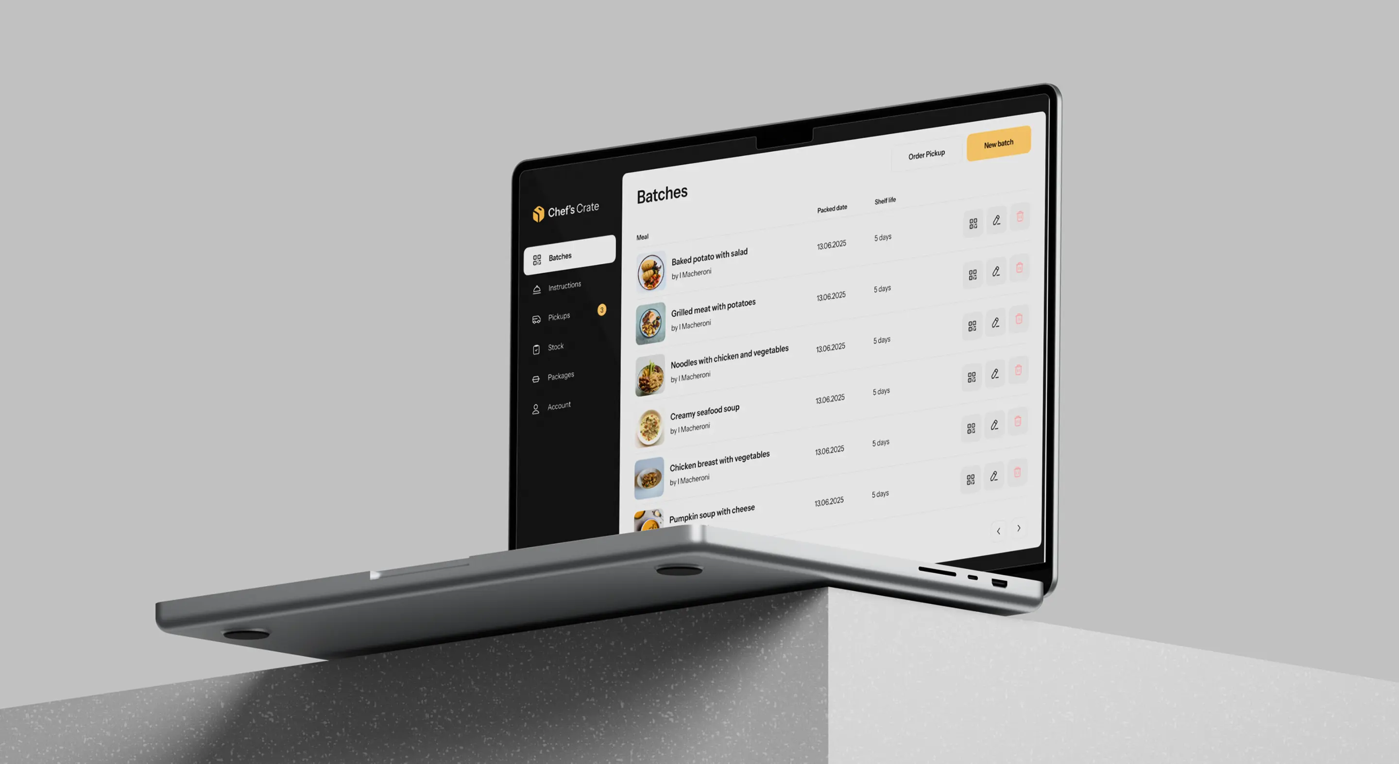 A laptop on a grey stone ledge showing the Chef's Crate Batches screen.