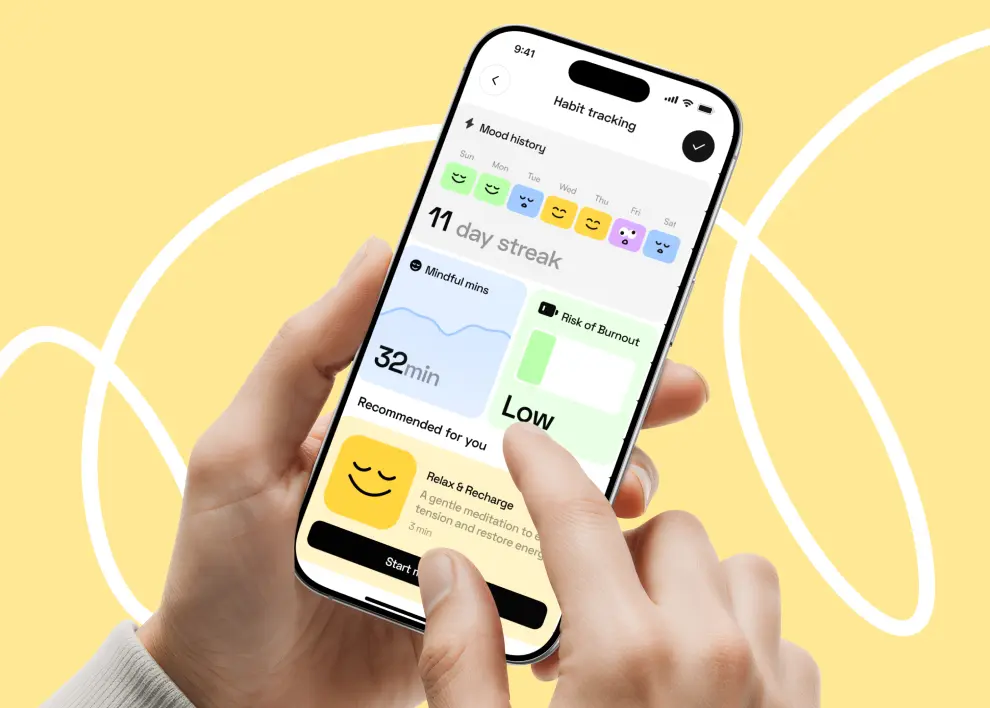 Hand holding an iPhone running a mobile app