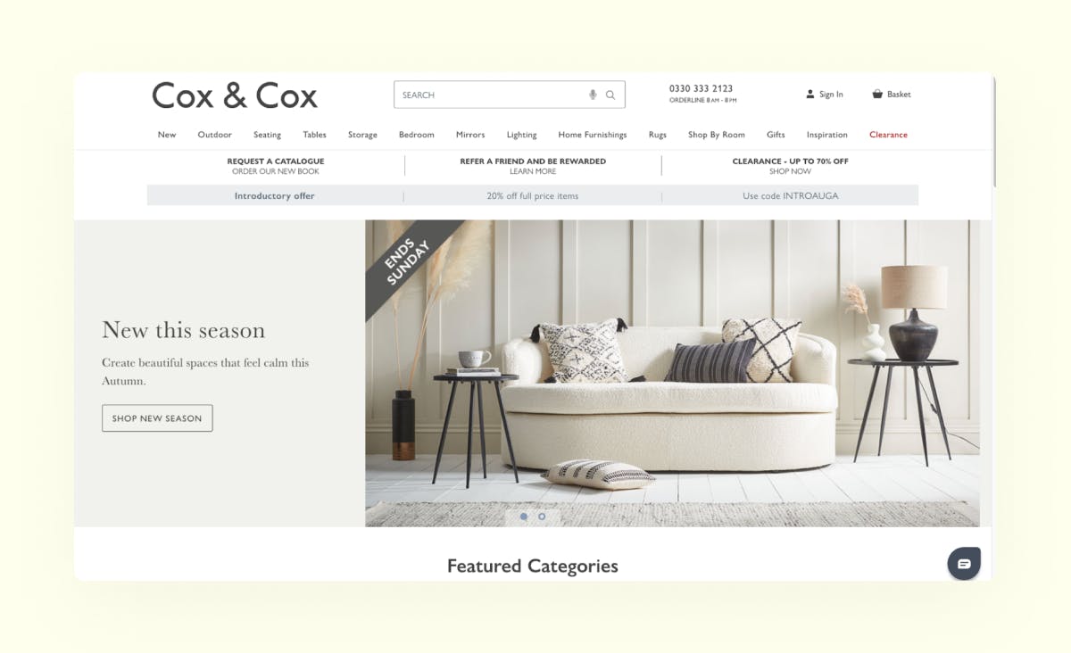 An example of an e-commerce website created using Adobe Commerce. The screenshot shows the homepage of Cox&Cox, an online store that sells interior items and furniture. The website is designed in a light, pastel color palette. The homepage features an advertisement for the new autumn collection.